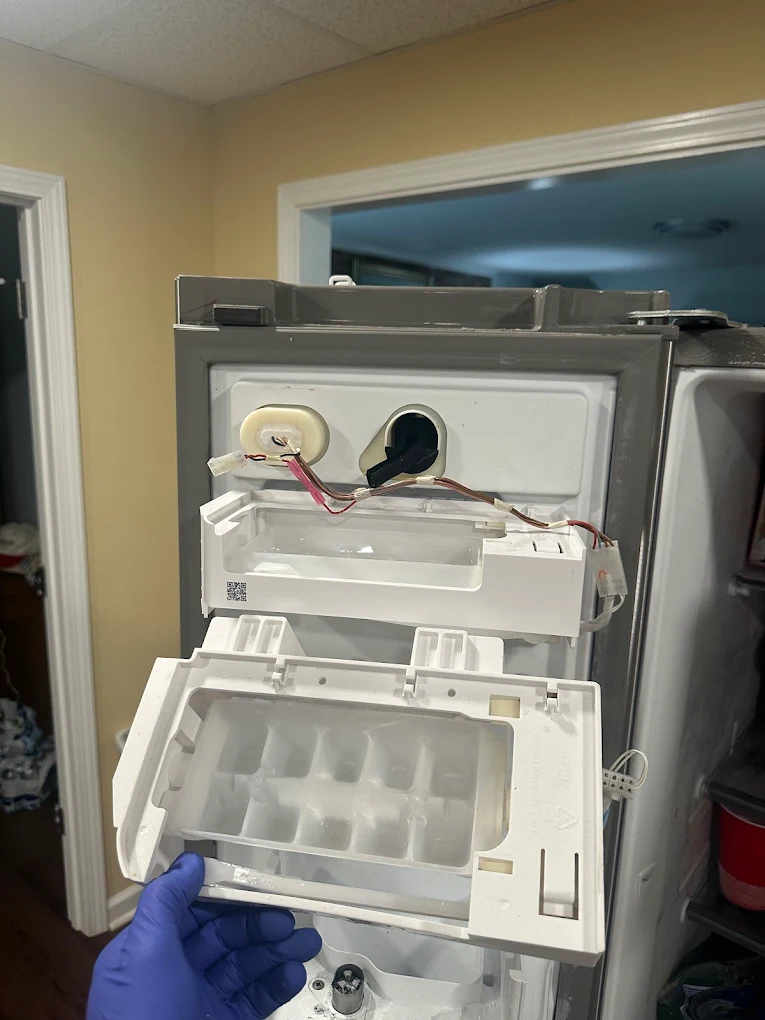 Open ice maker tray inside freezer compartment – Bozmanfix Appliance Repair Atlanta GA