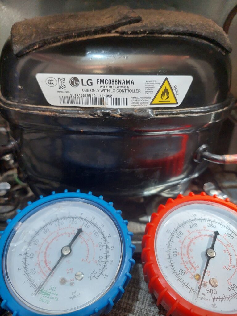 LG FMC088NAMA inverter compressor being pressure tested by Bozmanfix technician