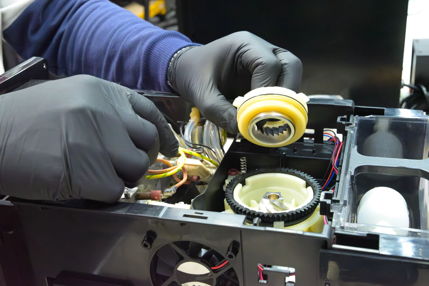 Super-automatic espresso machine opened for grinder repair
